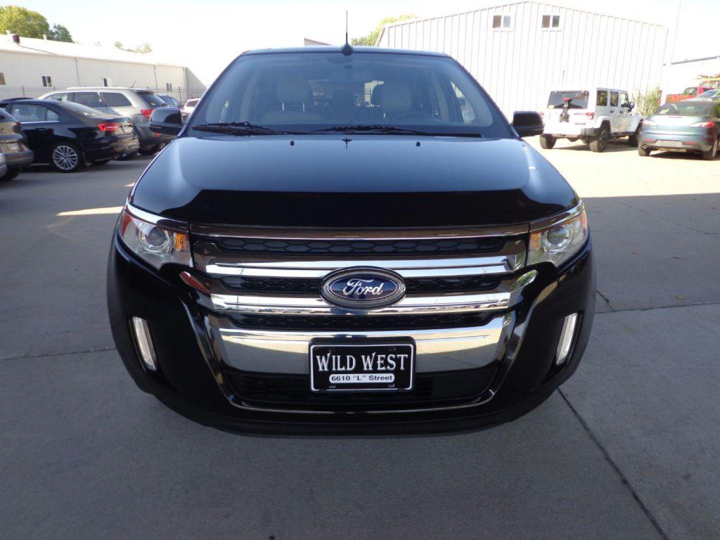 2013 BLACK FORD EDGE LIMITED (2FMDK4KC1DB) with an 3.5L engine, Automatic transmission, located at 6610 L St., Omaha, NE, 68117, (402) 731-7800, 41.212872, -96.014702 - 2-OWNER CLEAN CARFAX LOW MILEAGE LOADED WITH OPTIONS INCLUDING: NAV, BACKUP CAM, PANORAMIC ROOF, ADAPTIVE CRUISE, HID HEADLAMPS, POWER LIFTGATE, VISION PACKAGE, BLIND SPOT ASSIST AND NEWER TIRES! *****We have found that most customers do the majority of their shopping online before visitin - Photo#1