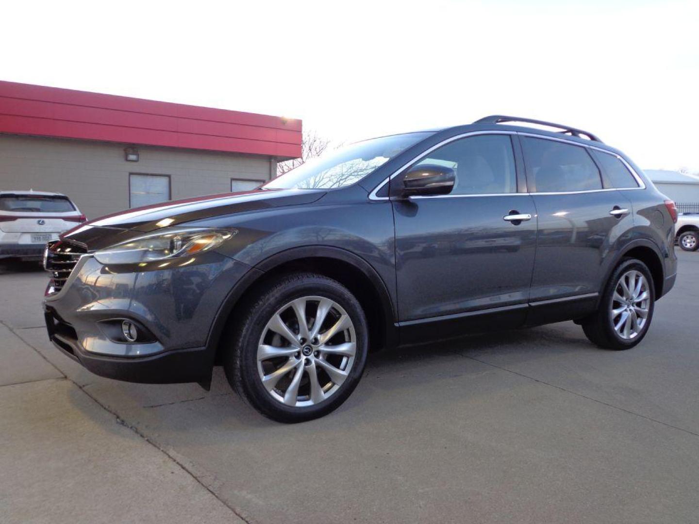 2014 GRAY MAZDA CX-9 GRAND TOURING (JM3TB3DV8E0) with an 3.7L engine, Automatic transmission, located at 6610 L St., Omaha, NE, 68117, (402) 731-7800, 41.212872, -96.014702 - 1-OWNER CLEAN CARFAX LOW MILEAGE LOADED WITH HEATED SEATS, 3RD ROW, SUNROOF, NAV, BACKUP CAM, BOSE AND MUCH MORE! *****We have found that most customers do the majority of their shopping online before visiting a dealership. For this reason we feel it necessary to have a competitive price on o - Photo#0