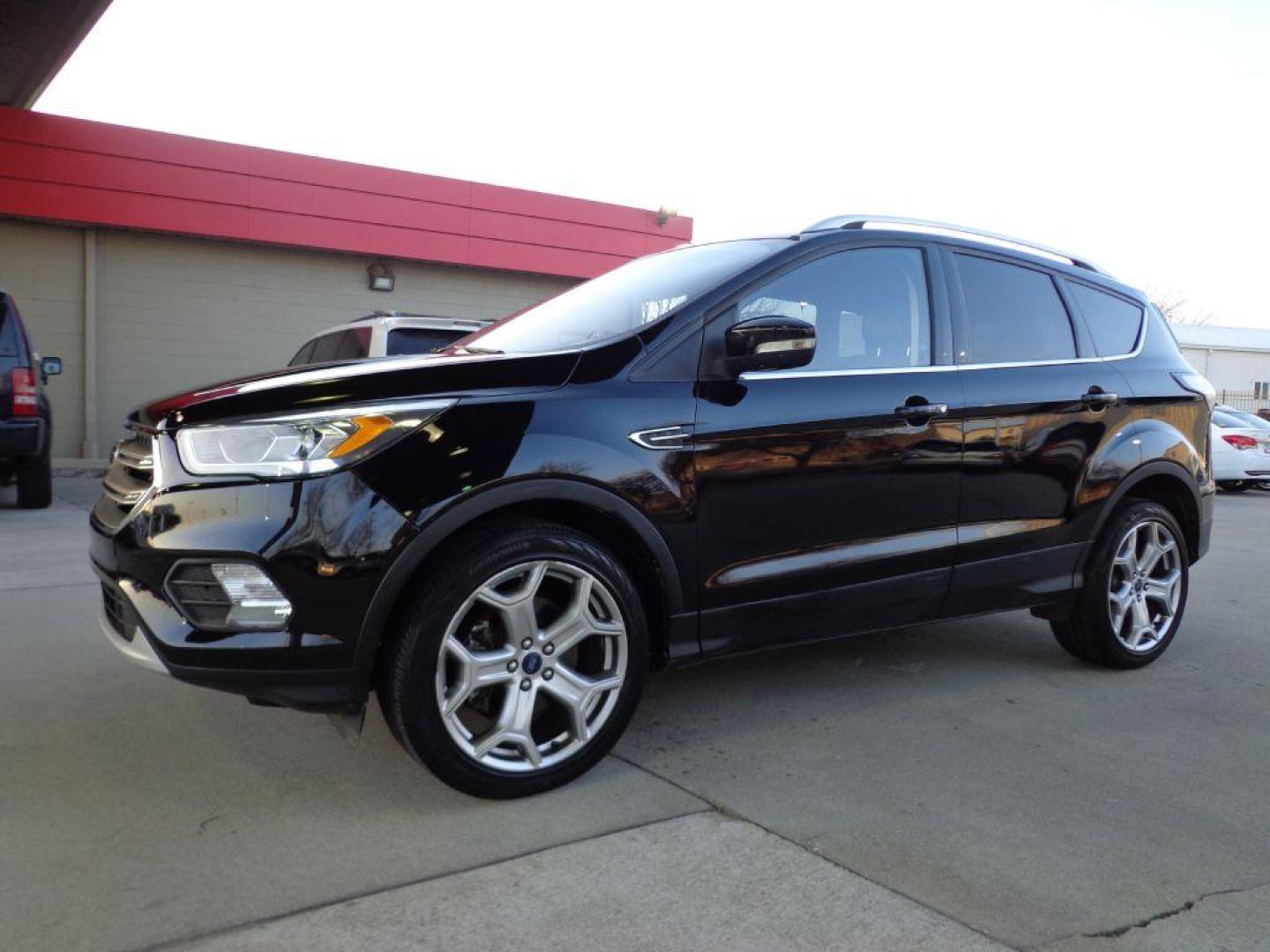 2017 BLACK FORD ESCAPE TITANIUM (1FMCU9J99HU) with an 2.0L engine, Automatic transmission, located at 6610 L St., Omaha, NE, 68117, (402) 731-7800, 41.212872, -96.014702 - SHARP 1-OWNER CLEAN CARFAX LOW MILEAGE LOADED WITH NAV, PANORAMIC ROOF, NEWER TIRES AND MUCH MORE! *****We have found that most customers do the majority of their shopping online before visiting a dealership. For this reason we feel it necessary to have a competitive price on our used vehicles - Photo#0