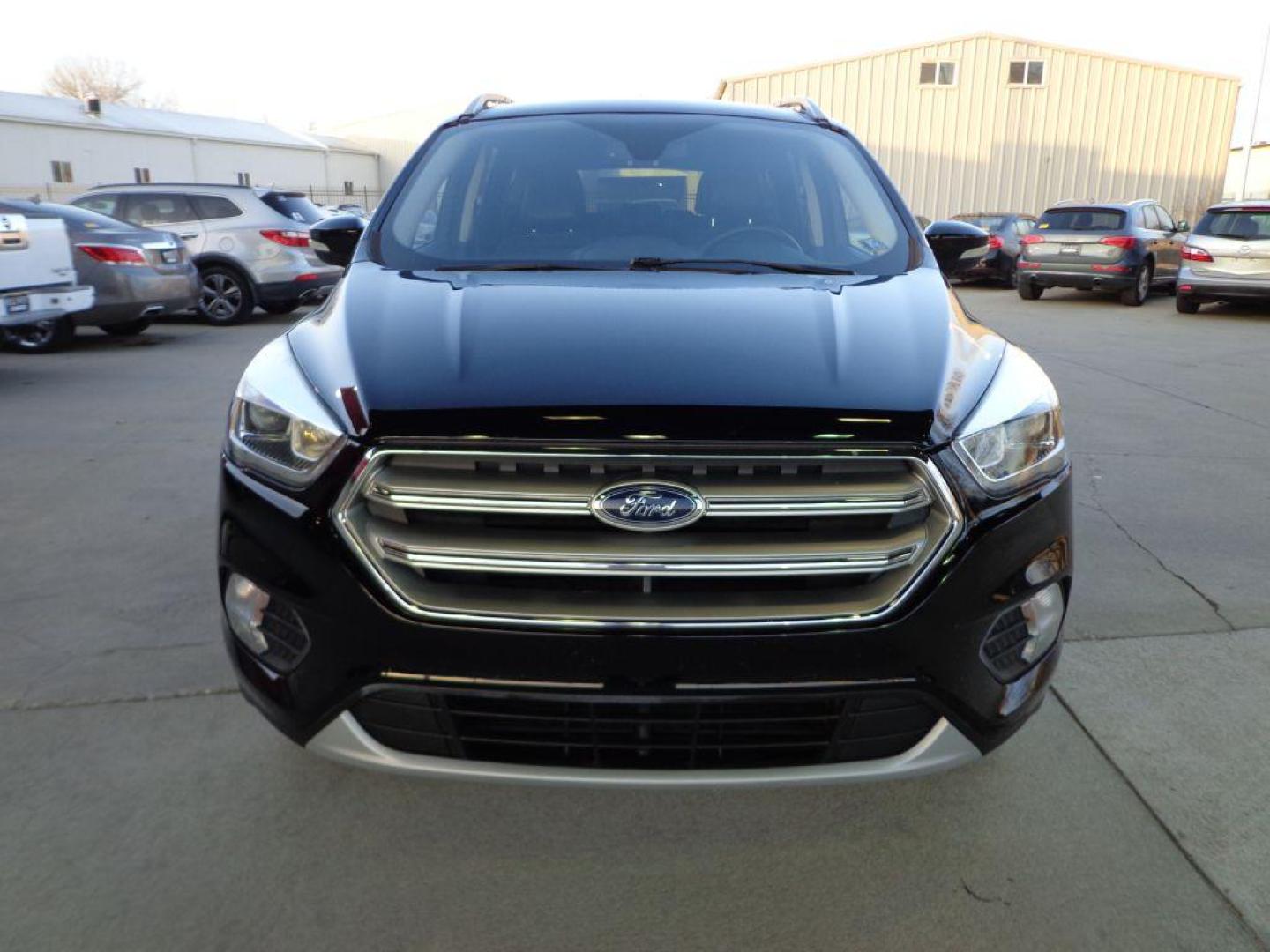 2017 BLACK FORD ESCAPE TITANIUM (1FMCU9J99HU) with an 2.0L engine, Automatic transmission, located at 6610 L St., Omaha, NE, 68117, (402) 731-7800, 41.212872, -96.014702 - SHARP 1-OWNER CLEAN CARFAX LOW MILEAGE LOADED WITH NAV, PANORAMIC ROOF, NEWER TIRES AND MUCH MORE! *****We have found that most customers do the majority of their shopping online before visiting a dealership. For this reason we feel it necessary to have a competitive price on our used vehicles - Photo#1