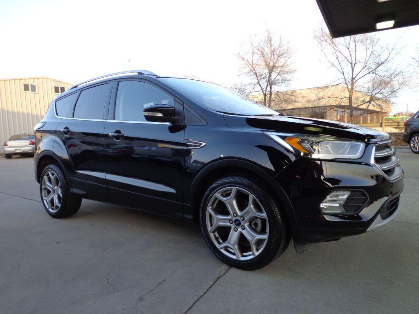 2017 BLACK FORD ESCAPE TITANIUM (1FMCU9J99HU) with an 2.0L engine, Automatic transmission, located at 6610 L St., Omaha, NE, 68117, (402) 731-7800, 41.212872, -96.014702 - SHARP 1-OWNER CLEAN CARFAX LOW MILEAGE LOADED WITH NAV, PANORAMIC ROOF, NEWER TIRES AND MUCH MORE! *****We have found that most customers do the majority of their shopping online before visiting a dealership. For this reason we feel it necessary to have a competitive price on our used vehicles - Photo#2