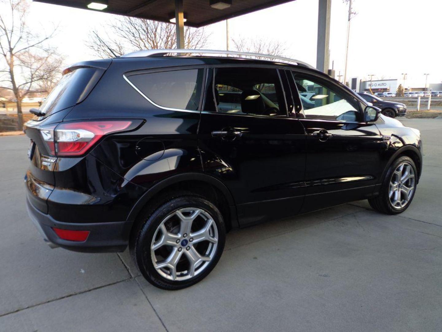 2017 BLACK FORD ESCAPE TITANIUM (1FMCU9J99HU) with an 2.0L engine, Automatic transmission, located at 6610 L St., Omaha, NE, 68117, (402) 731-7800, 41.212872, -96.014702 - SHARP 1-OWNER CLEAN CARFAX LOW MILEAGE LOADED WITH NAV, PANORAMIC ROOF, NEWER TIRES AND MUCH MORE! *****We have found that most customers do the majority of their shopping online before visiting a dealership. For this reason we feel it necessary to have a competitive price on our used vehicles - Photo#3