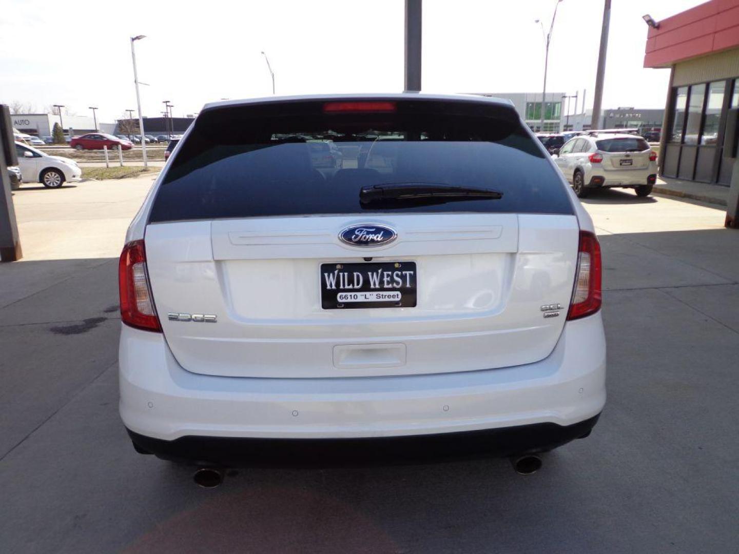 2013 WHITE FORD EDGE SEL (2FMDK4JC3DB) with an 3.5L engine, Automatic transmission, located at 6610 L St., Omaha, NE, 68117, (402) 731-7800, 41.212872, -96.014702 - 1-OWNER CLEAN CARFAX LOW MILEAGE LOADED WITH PANORAMIC SUNROOF, NAV, BACKUP CAM AND NEWER TIRES! *****We have found that most customers do the majority of their shopping online before visiting a dealership. For this reason we feel it necessary to have a competitive price on our used vehicles - Photo#4