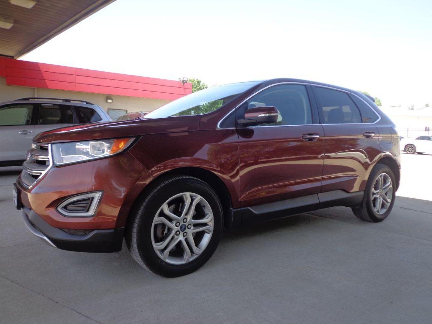 2015 BROWN FORD EDGE TITANIUM (2FMTK4K87FB) with an 3.5L engine, Automatic transmission, located at 6610 L St., Omaha, NE, 68117, (402) 731-7800, 41.212872, -96.014702 - 1-OWNER CLEAN CARFAX LOW MILEAGE LOADED WITH PANORAMIC ROOF, HEATED/COOLED FRONT SEATS, HEATED REAR SEATS, BLIND SPOT MONITORING, REMOTE START, NAV, BACKUP CAM, POWER LIFTGATE, ALL WEATHER MATS AND MUCH MORE! *****We have found that most customers do the majority of their shopping online before - Photo#0