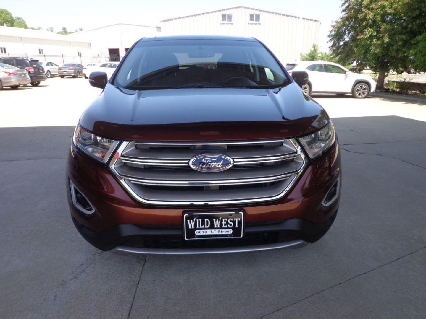 2015 BROWN FORD EDGE TITANIUM (2FMTK4K87FB) with an 3.5L engine, Automatic transmission, located at 6610 L St., Omaha, NE, 68117, (402) 731-7800, 41.212872, -96.014702 - 1-OWNER CLEAN CARFAX LOW MILEAGE LOADED WITH PANORAMIC ROOF, HEATED/COOLED FRONT SEATS, HEATED REAR SEATS, BLIND SPOT MONITORING, REMOTE START, NAV, BACKUP CAM, POWER LIFTGATE, ALL WEATHER MATS AND MUCH MORE! *****We have found that most customers do the majority of their shopping online before - Photo#1