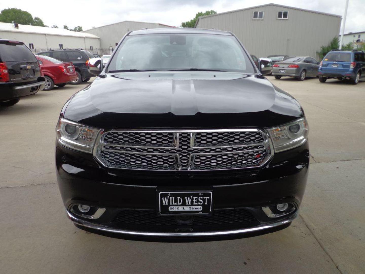 2015 BLACK DODGE DURANGO CITADEL (1C4SDJET7FC) with an 5.7L engine, Automatic transmission, located at 6610 L St., Omaha, NE, 68117, (402) 731-7800, 41.212872, -96.014702 - 1-OWNER CLEAN CARFAX LOW MILEAGE LOADED WITH HEATED/COOLED FROMT SEATS, HEATED REAR SEATS, THIRD ROW SEAT, REAR ENTERTAINMENT, SUNROOF, NAV, BACKUP CAM, ADAPTIVE CRUISE, BLIND SPOT/CROSS PATH DETECTION, FRONT COLLISION WARNING AND NEWER TIRES! *****We have found that most customers do the maj - Photo#1