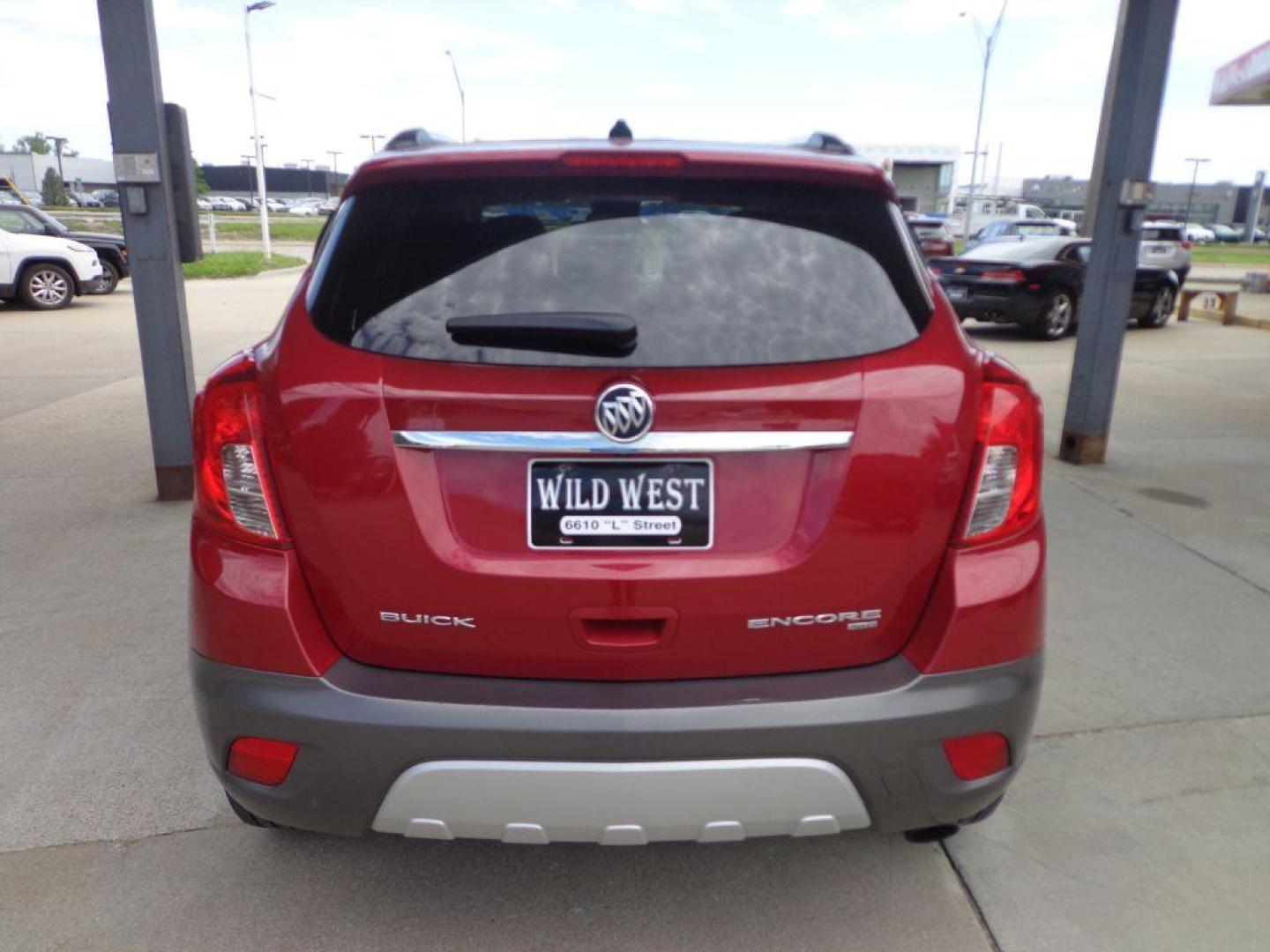 2013 MAROON BUICK ENCORE LEATHER (KL4CJGSBXDB) with an 1.4L engine, Automatic transmission, located at 6610 L St., Omaha, NE, 68117, (402) 731-7800, 41.212872, -96.014702 - Photo#4