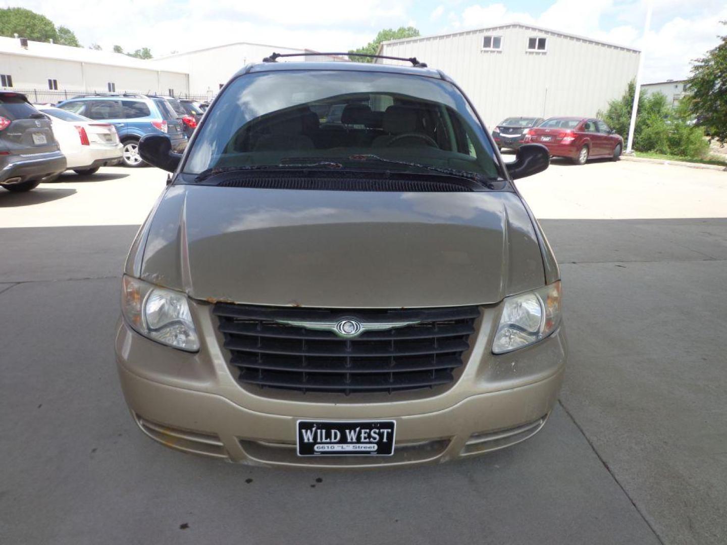 2006 TAN CHRYSLER TOWN and COUNTRY (1A4GP45R36B) with an 3.3L engine, Automatic transmission, located at 6610 L St., Omaha, NE, 68117, (402) 731-7800, 41.212872, -96.014702 - Photo#1