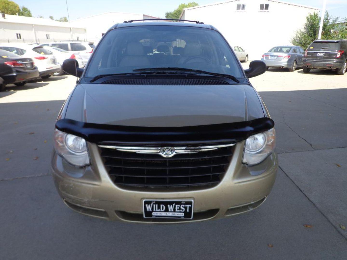 2007 TAN CHRYSLER TOWN and COUNTRY TOURING (2A4GP54LX7R) with an 3.8L engine, Automatic transmission, located at 6610 L St., Omaha, NE, 68117, (402) 731-7800, 41.212872, -96.014702 - FRESH TRADE, LOW MILEAGE, PRE-INSPECTED, HEATED LEATHER, POWER DOORS, COLD A/C AND NEWER TIRES! THERE IS SURFACE RUST PRESENT! *****We have found that most customers do the majority of their shopping online before visiting a dealership. For this reason we feel it necessary to have a competitive - Photo#1