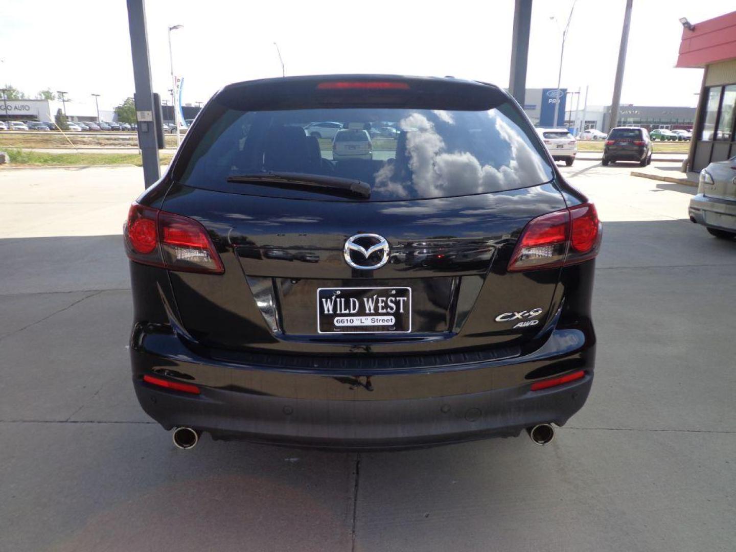 2013 BLACK MAZDA CX-9 TOURING (JM3TB3CVXD0) with an 3.7L engine, Automatic transmission, located at 6610 L St., Omaha, NE, 68117, (402) 731-7800, 41.212872, -96.014702 - 1-OWNER CLEAN CARFAX LOW MILEAGE LOADED WITH NAV, BACKUP CAM, SUNROOF, 3RD ROW, HEATED LEATHER, BOSE AUDIO, BSM AND NEWER TIRES! *****We have found that most customers do the majority of their shopping online before visiting a dealership. For this reason we feel it necessary to have a competi - Photo#4