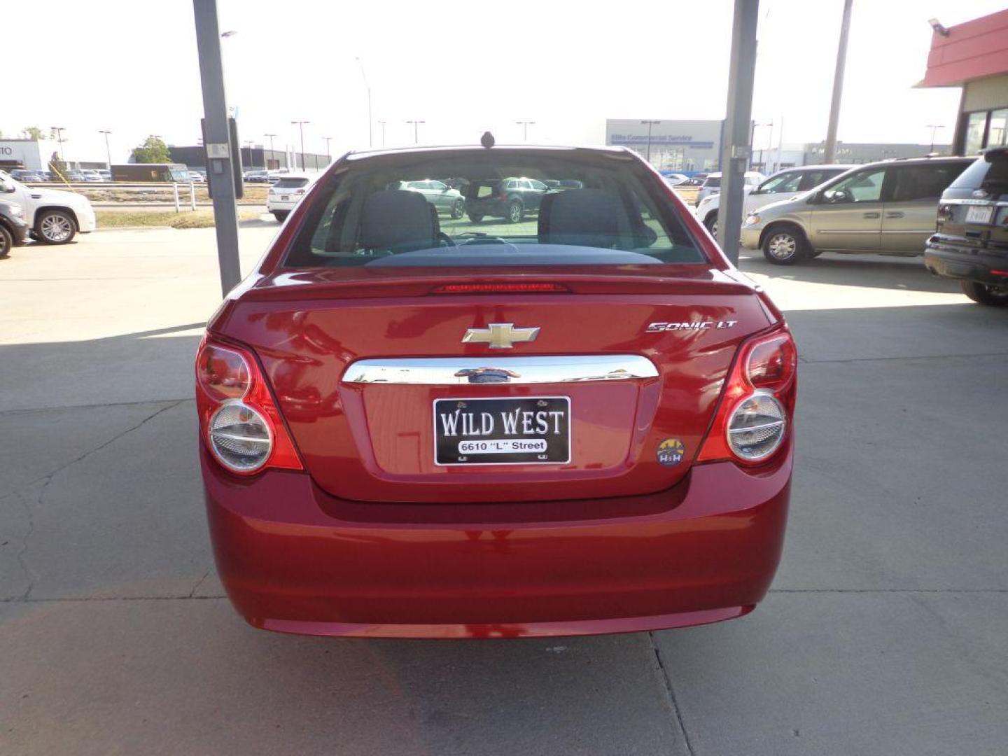 2013 RED CHEVROLET SONIC LT (1G1JC5SH2D4) with an 1.8L engine, Automatic transmission, located at 6610 L St., Omaha, NE, 68117, (402) 731-7800, 41.212872, -96.014702 - 1-OWNER, CLEAN CARFAX , LOW MILEAGE WITH NEWER TIRES! *****We have found that most customers do the majority of their shopping online before visiting a dealership. For this reason we feel it necessary to have a competitive price on our used vehicles right up front. We spend time researching the - Photo#4