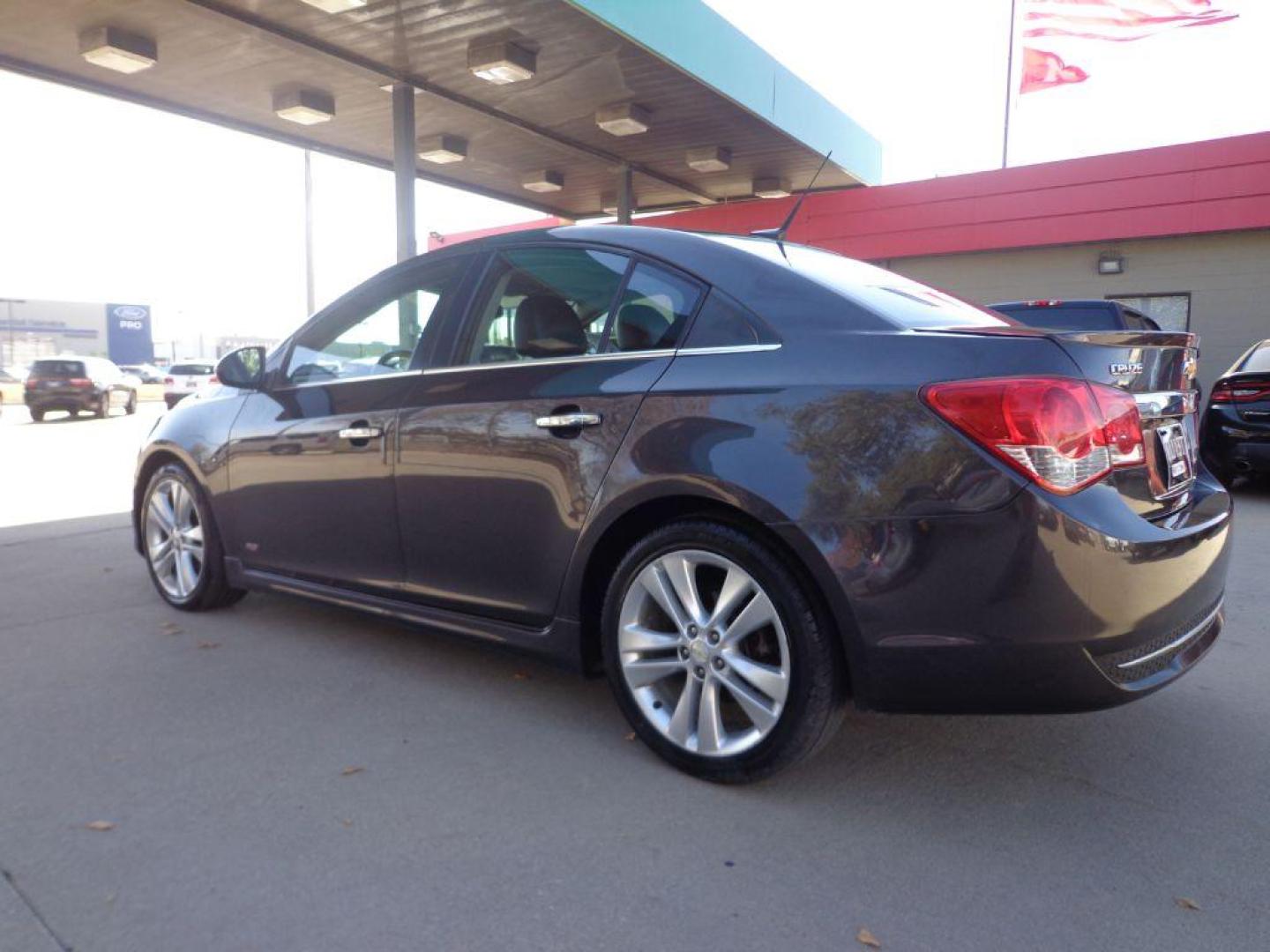 2014 BLACK CHEVROLET CRUZE LTZ (1G1PG5SB5E7) with an 1.4L engine, Automatic transmission, located at 6610 L St., Omaha, NE, 68117, (402) 731-7800, 41.212872, -96.014702 - 2-OWNER, CLEAN CARFAX WITH A SUNROOF, BACKUP CAM AND NEWER TIRES! *****We have found that most customers do the majority of their shopping online before visiting a dealership. For this reason we feel it necessary to have a competitive price on our used vehicles right up front. We spend time r - Photo#5