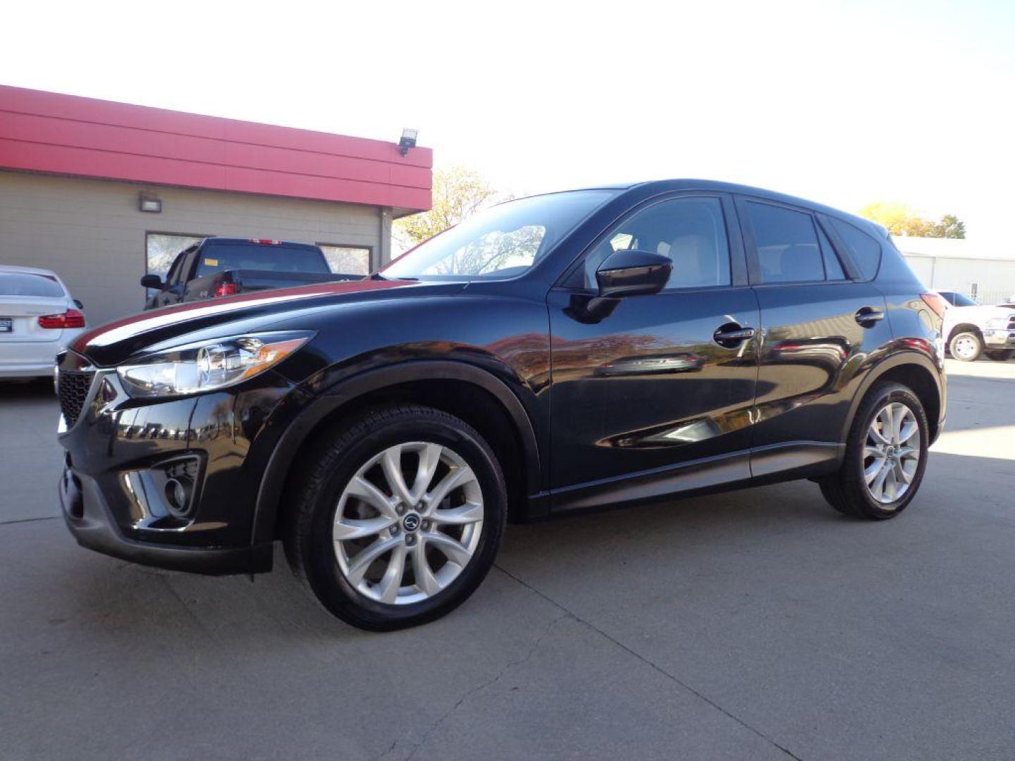 2013 BLACK MAZDA CX-5 GT (JM3KE4DEXD0) with an 2.0L engine, Automatic transmission, located at 6610 L St., Omaha, NE, 68117, (402) 731-7800, 41.212872, -96.014702 - SHARP CX-5 WITH A CLEAN CARFAX, LOADED WITH HEATED LEATHER, SUNROOF, NAV, BACKUP CAM, NEWER TIRES AND MUCH MORE! *****We have found that most customers do the majority of their shopping online before visiting a dealership. For this reason we feel it necessary to have a competitive price on our - Photo#0