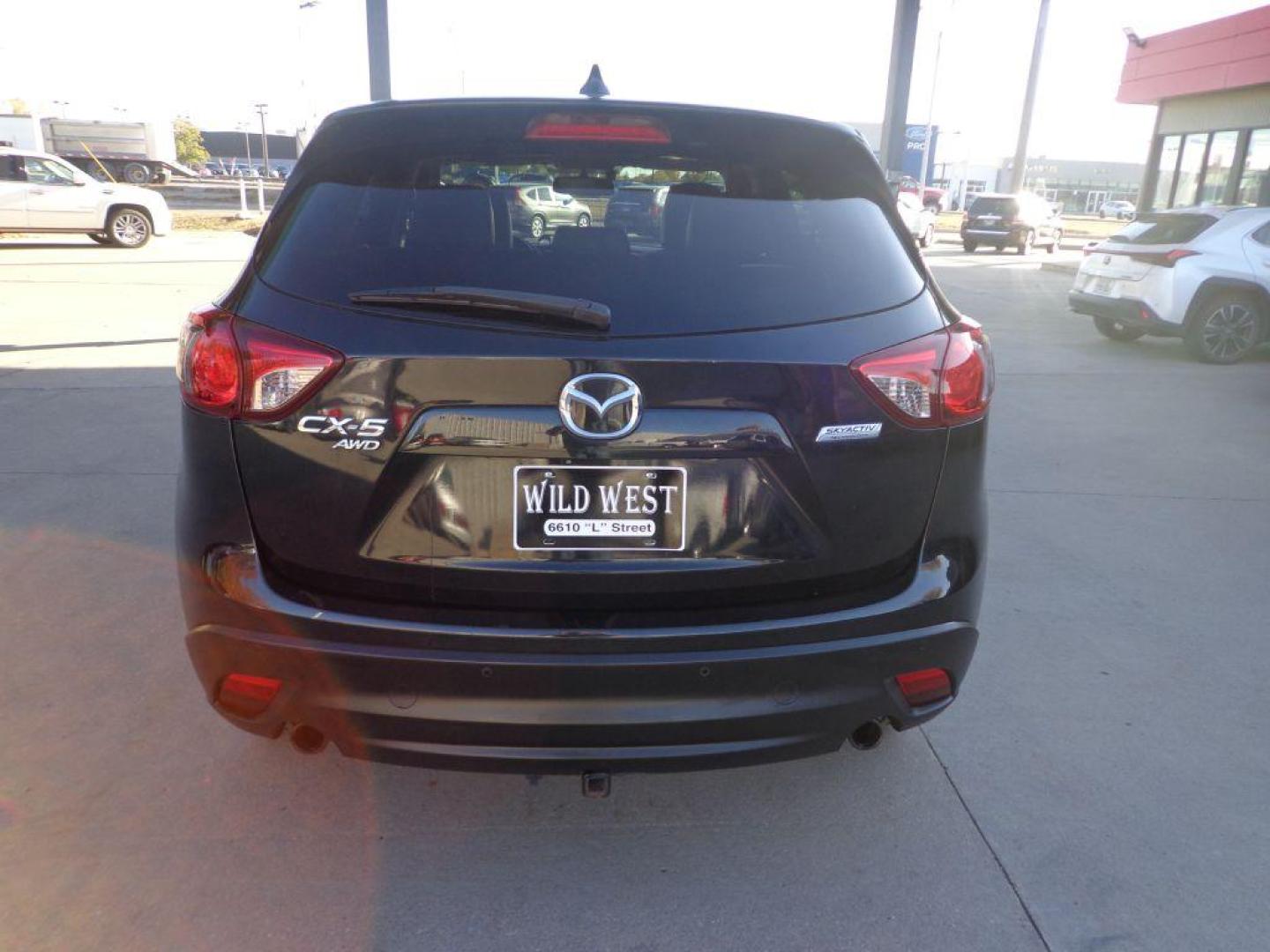 2013 BLACK MAZDA CX-5 GT (JM3KE4DEXD0) with an 2.0L engine, Automatic transmission, located at 6610 L St., Omaha, NE, 68117, (402) 731-7800, 41.212872, -96.014702 - SHARP CX-5 WITH A CLEAN CARFAX, LOADED WITH HEATED LEATHER, SUNROOF, NAV, BACKUP CAM, NEWER TIRES AND MUCH MORE! *****We have found that most customers do the majority of their shopping online before visiting a dealership. For this reason we feel it necessary to have a competitive price on our - Photo#4