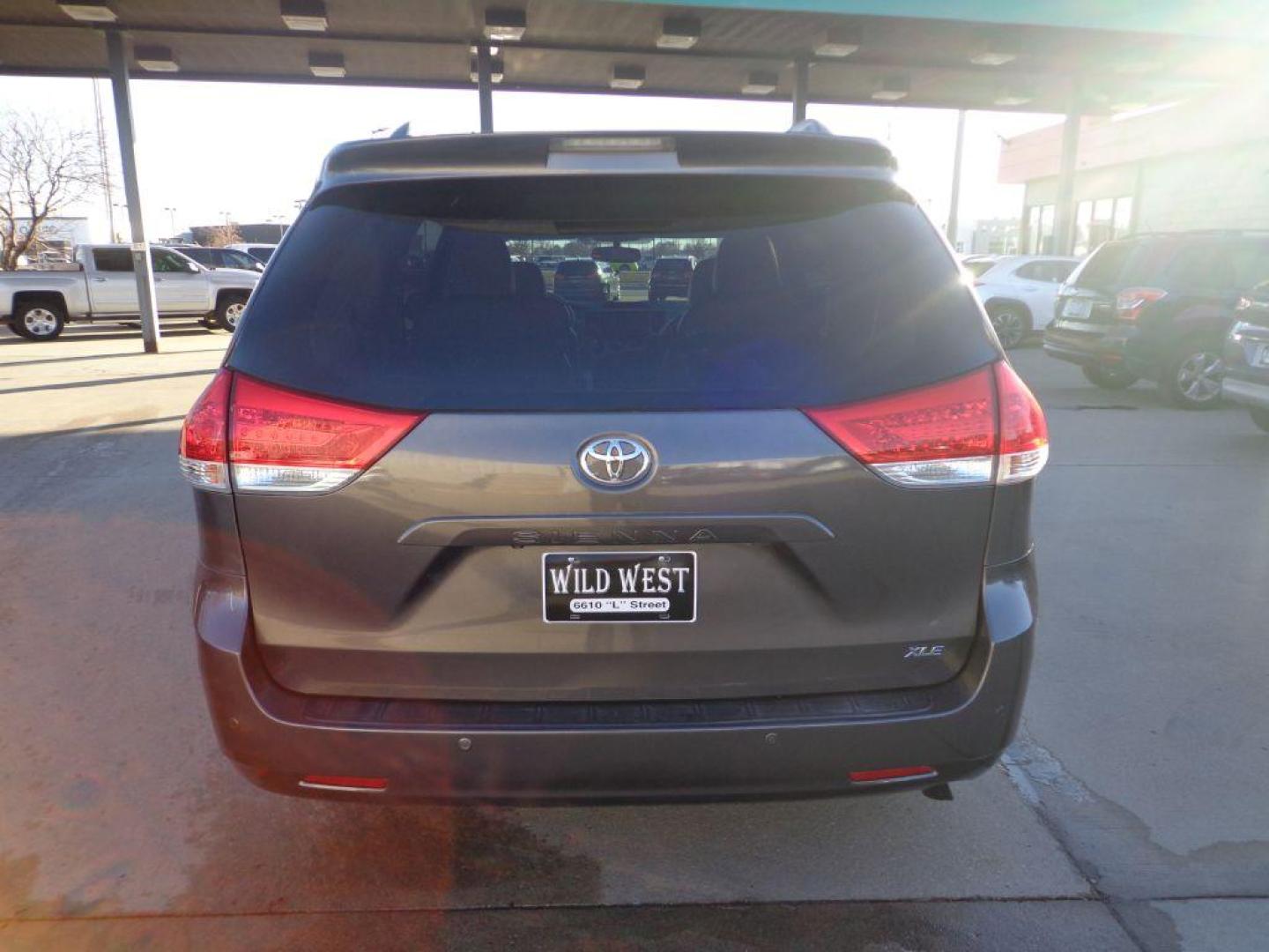 2012 GRAY TOYOTA SIENNA XLE (5TDYK3DC9CS) with an 3.5L engine, Automatic transmission, located at 6610 L St., Omaha, NE, 68117, (402) 731-7800, 41.212872, -96.014702 - 2-OWNER, CLEAN CARFAX, LOW MILEAGE, HEATED LEATHER, SUNROOF, NAV, BACKUP CAM AND NEWER TIRES! *****We have found that most customers do the majority of their shopping online before visiting a dealership. For this reason we feel it necessary to have a competitive price on our used vehicles rig - Photo#4