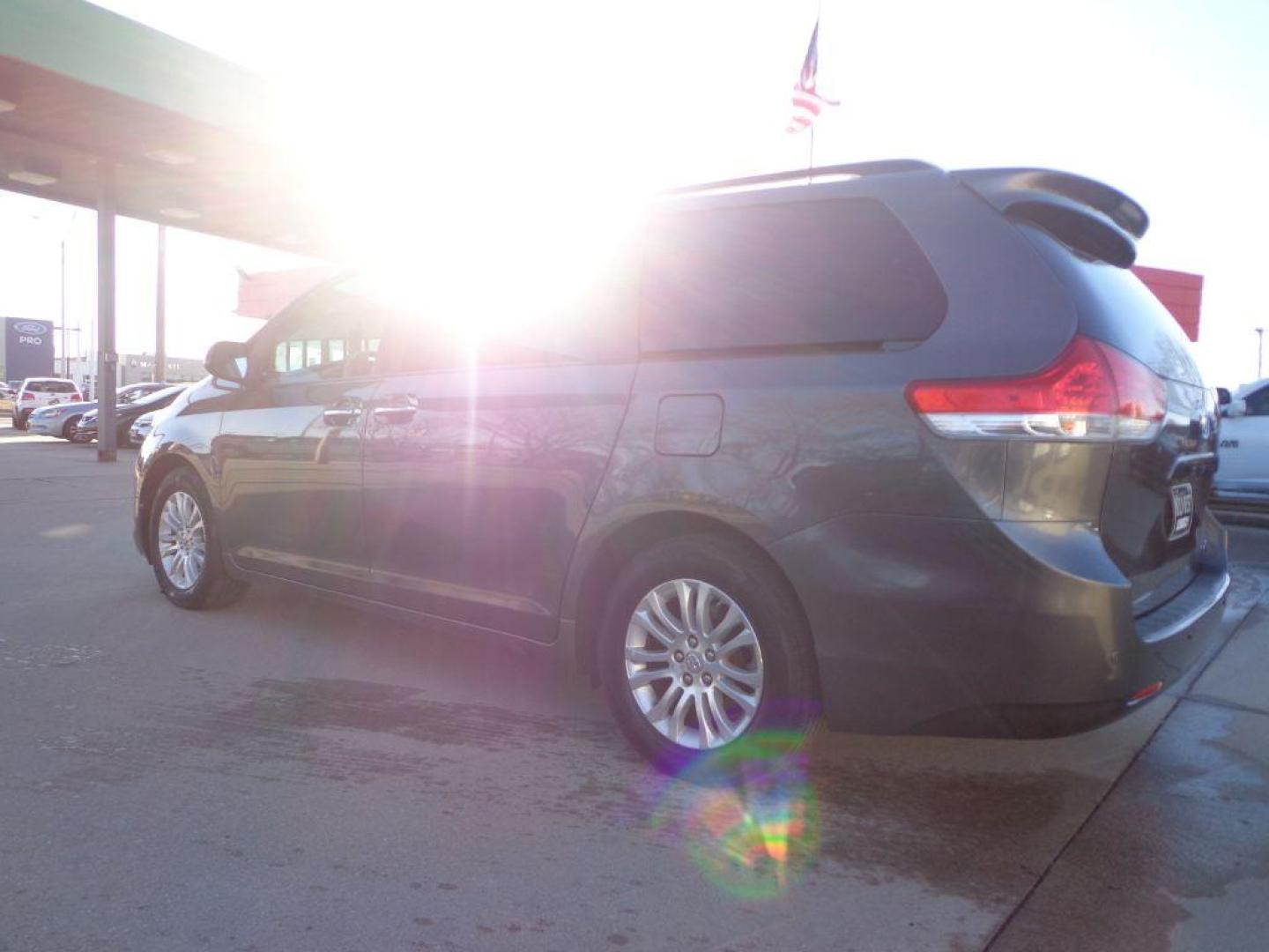 2012 GRAY TOYOTA SIENNA XLE (5TDYK3DC9CS) with an 3.5L engine, Automatic transmission, located at 6610 L St., Omaha, NE, 68117, (402) 731-7800, 41.212872, -96.014702 - 2-OWNER, CLEAN CARFAX, LOW MILEAGE, HEATED LEATHER, SUNROOF, NAV, BACKUP CAM AND NEWER TIRES! *****We have found that most customers do the majority of their shopping online before visiting a dealership. For this reason we feel it necessary to have a competitive price on our used vehicles rig - Photo#5