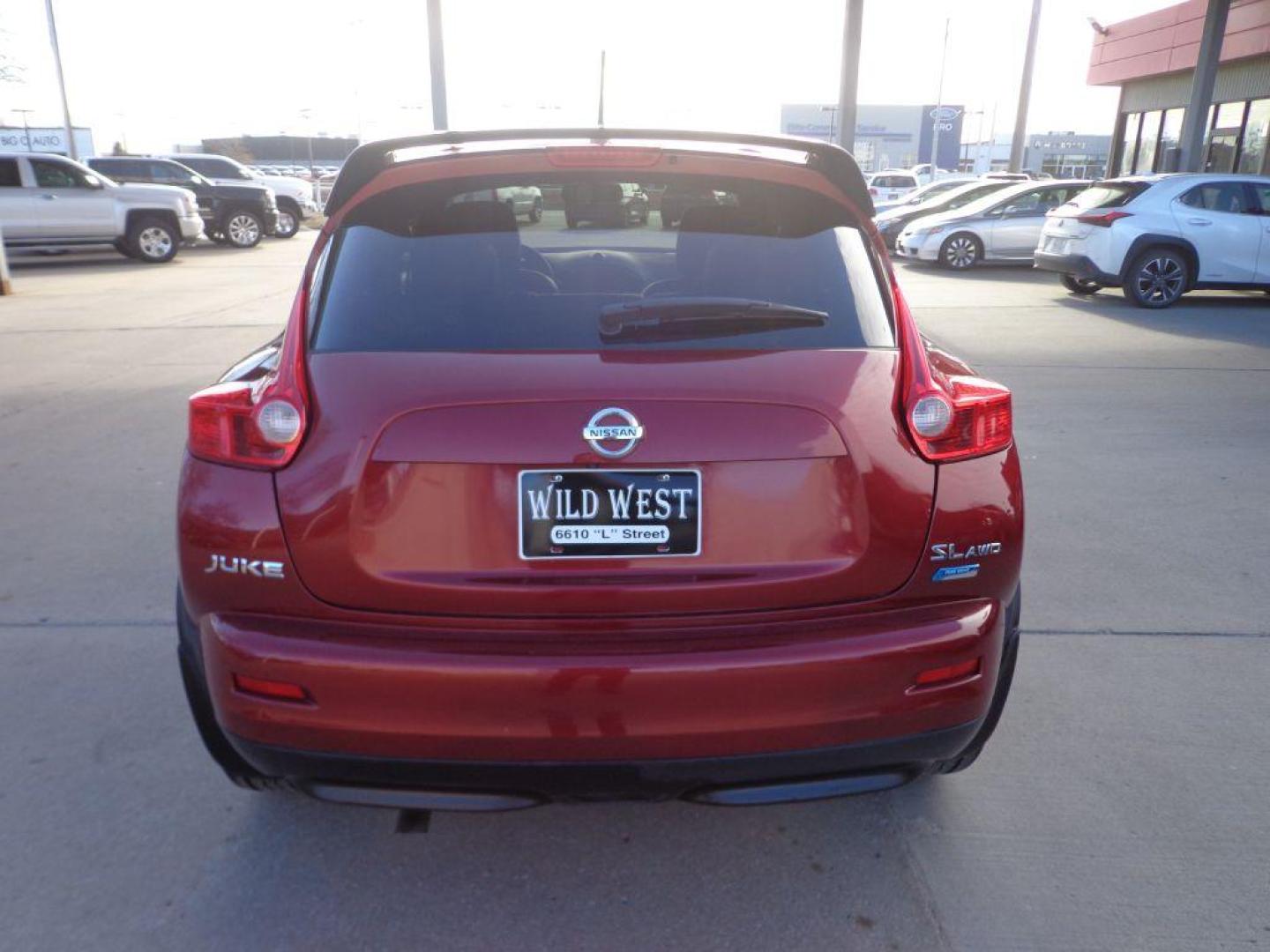 2013 RED NISSAN JUKE SL (JN8AF5MV4DT) with an 1.6L engine, Continuously Variable transmission, located at 6610 L St., Omaha, NE, 68117, (402) 731-7800, 41.212872, -96.014702 - 2-OWNER, CLEAN CARFAX, LOW MILEAGE LOADED WITH HEATED LEATHER, SUNROOF, NAV, BACKUP CAM AND NEWER TIRES! *****We have found that most customers do the majority of their shopping online before visiting a dealership. For this reason we feel it necessary to have a competitive price on our used v - Photo#4