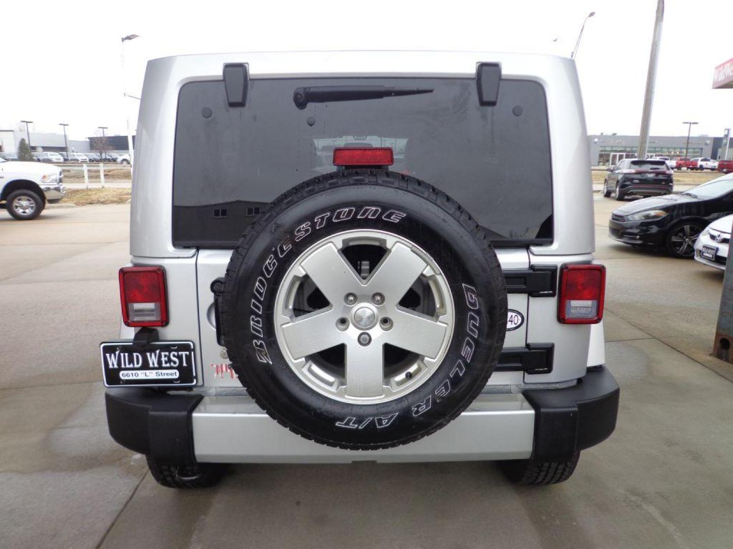 2012 SILVER JEEP WRANGLER UNLIMI SAHARA (1C4HJWEG2CL) with an 3.6L engine, Automatic transmission, located at 6610 L St., Omaha, NE, 68117, (402) 731-7800, 41.212872, -96.014702 - 2-OWNER, CLEAN CARFAX , LOW MILEAGE, HEATED LEATHER, AND NAV! *****We have found that most customers do the majority of their shopping online before visiting a dealership. For this reason we feel it necessary to have a competitive price on our used vehicles right up front. We spend time resear - Photo#4