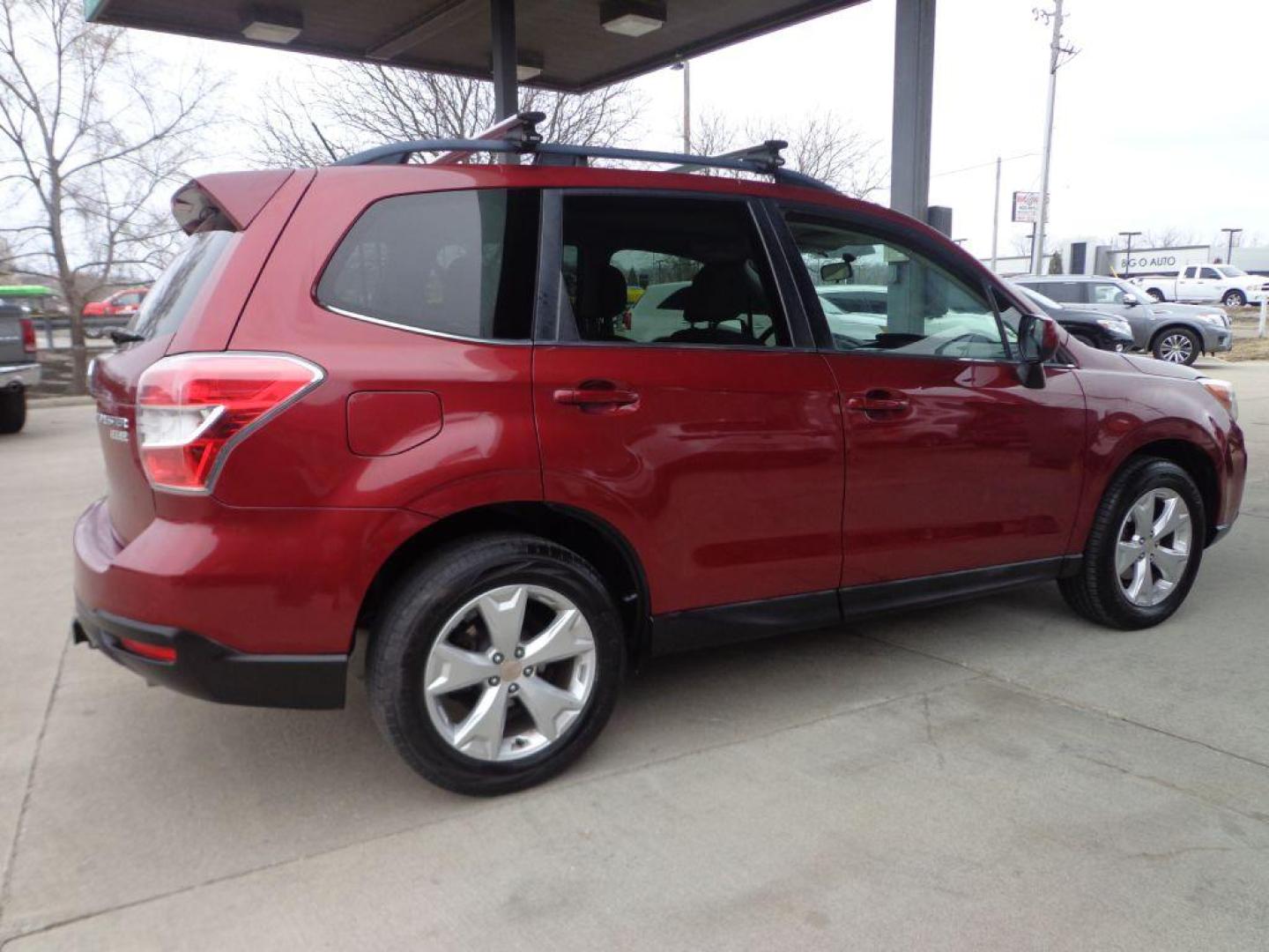 2014 RED SUBARU FORESTER 2.5I LIMITED (JF2SJAHC1EH) with an 2.5L engine, Continuously Variable transmission, located at 6610 L St., Omaha, NE, 68117, (402) 731-7800, 41.212872, -96.014702 - SHARP LIMITED MODEL WITH SUNROOF, BACKUP CAM, HEATED LEATHER AND NEWER TIRES! *****We have found that most customers do the majority of their shopping online before visiting a dealership. For this reason we feel it necessary to have a competitive price on our used vehicles right up front. W - Photo#3